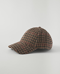 A plaid baseball cap rests on a plain white background. carousel Product Image 1