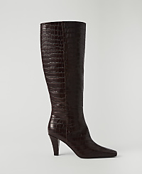 A dark brown, croc-embossed leather knee-high boot with a pointed toe and stiletto heel stands against a plain white background. carousel Product Image 1