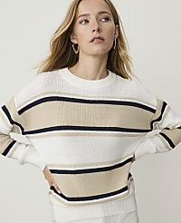 A blonde woman in a striped sweater poses against a plain, light background. carousel Product Image 1