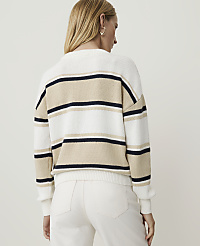 A woman in a striped sweater and white pants stands against a plain white background. carousel Product Image 2