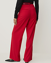 A person wearing bright red wide-leg pants and a black top stands against a plain white background. carousel Product Image 3