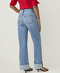 A person in a red shirt and cuffed blue jeans stands against a plain white background. carousel Product Image 3