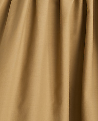 A close-up of tan fabric with soft folds fills the frame, creating a textured, monochromatic background. carousel Product Image 4