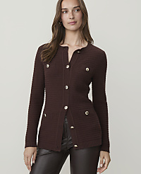 A woman in a brown cardigan stands against a plain background. carousel Product Image 1