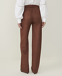 A person wearing brown wide-leg pants and a white blouse stands against a plain, light-colored background. carousel Product Image 3