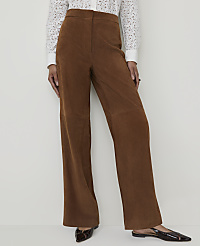 A person stands in brown corduroy pants and a white lace top against a plain white background. carousel Product Image 2