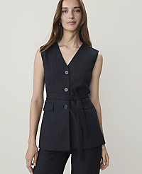 A woman in a pinstripe vest and pants stands against a plain white background. carousel Product Image 1