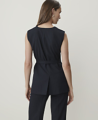 A woman in a pinstripe vest and pants stands against a plain, light background. carousel Product Image 2
