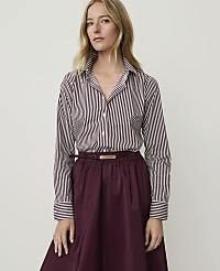 A woman in a striped shirt and burgundy skirt stands against a plain white background. carousel Product Image 1