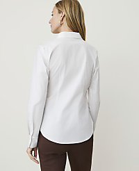 A woman in a white button-down shirt and brown pants stands against a plain white background. carousel Product Image 2