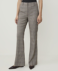 A person stands in the foreground wearing brown plaid flared trousers and dark pointed-toe shoes, against a plain white background. carousel Product Image 2
