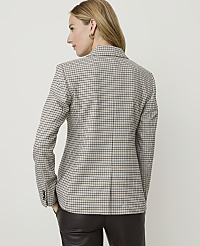 A woman in a checkered blazer stands against a plain, light background. carousel Product Image 3