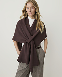 A woman in a brown shawl and plaid pants stands against a plain white background. carousel Product Image 1
