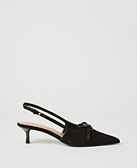 A black suede slingback heel with a bow detail rests on a white background. carousel Product Image 1