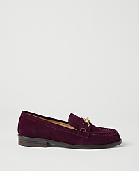 A deep purple suede loafer with a gold chain detail rests on a plain white background. carousel Product Image 1