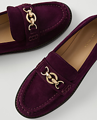 A pair of deep purple suede loafers with gold chain accents rests on a plain white background. carousel Product Image 2