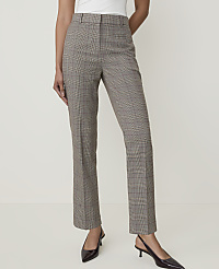 A person stands in the foreground wearing plaid trousers and black heels against a plain, light-colored background. carousel Product Image 2