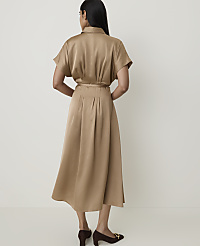 A woman in a tan satin dress stands against a plain, light background. carousel Product Image 2