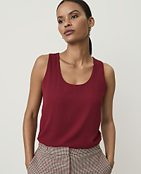 A woman in a red tank top and plaid pants stands against a plain background. carousel Product Image 1