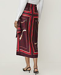 A woman in a patterned skirt and white shirt stands against a plain white background. carousel Product Image 3