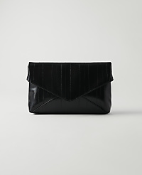 A black, textured envelope clutch rests on a white surface against a plain white background. carousel Product Image 1