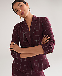 A woman in a burgundy plaid suit stands with her arms crossed against a plain gray background. carousel Product Image 4
