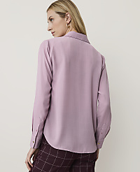 A woman in a mauve blouse and plaid pants stands against a plain, light background. carousel Product Image 2