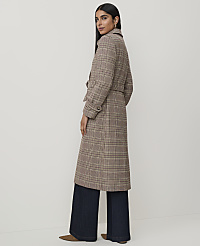 A woman in a plaid coat and wide-leg jeans stands against a plain background. carousel Product Image 2