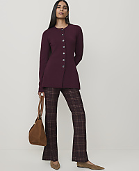 A woman in a burgundy jacket and plaid pants stands with a brown bag, against a plain white background. carousel Product Image 3