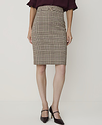 A woman models a brown plaid pencil skirt and dark heels against a plain white background. carousel Product Image 2
