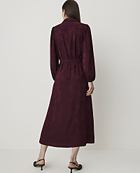 A woman in a burgundy dress stands against a plain, light-colored background. carousel Product Image 2