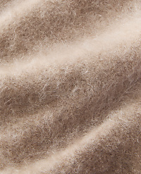 Soft, fuzzy brown fibers create a textured foreground against a lighter, blurred background. carousel Product Image 3
