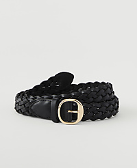 A black braided leather belt with a gold oval buckle lies coiled on a plain white background. carousel Product Image 1