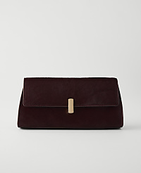 A dark red clutch with a gold clasp rests on a white surface against a plain white background. carousel Product Image 1