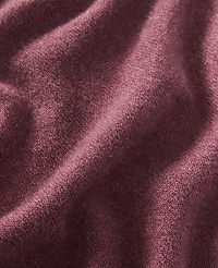 A close-up of a textured, rose-colored fabric with soft folds fills the frame, with no discernible background. carousel Product Image 2