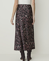 A woman in a black and pink paisley skirt and dark boots stands against a plain white background. carousel Product Image 3