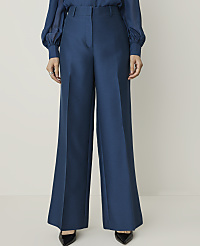 A person stands in wide-leg teal trousers and black pointed-toe heels against a plain white background. carousel Product Image 2