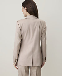 A woman in a beige plaid suit stands against a plain, light-colored background. carousel Product Image 2