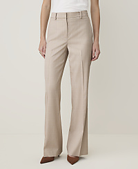 A person in beige pinstripe flared trousers and brown pointed-toe heels stands against a plain, light-colored background. carousel Product Image 2