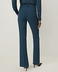 A person wearing teal dress pants and black heels stands against a plain, light-colored background. carousel Product Image 3
