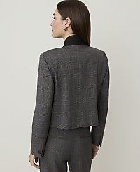 A woman in a plaid suit stands against a plain, light-colored background. carousel Product Image 2