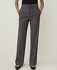 A person stands in front of a plain white background, wearing plaid trousers and black pointed-toe shoes. carousel Product Image 1