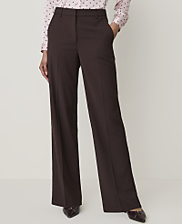 A person in a pink polka dot shirt and brown wide-leg trousers stands against a plain white background. carousel Product Image 2