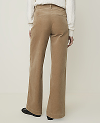 A person wearing tan corduroy pants and a white sweater stands against a plain, light-colored background. carousel Product Image 3