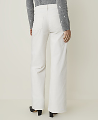 A person wearing white wide-leg pants and a grey sweater stands against a plain, light-colored background. carousel Product Image 3