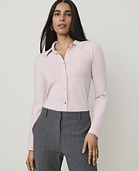 A woman in a pink collared shirt and gray pinstripe pants stands against a plain gray background. carousel Product Image 1