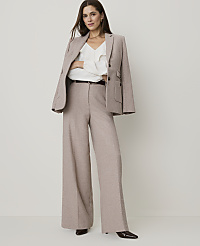 A woman in a beige pantsuit stands against a plain white background. carousel Product Image 1