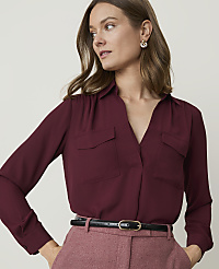 A woman in a burgundy blouse and pink pants stands against a plain, light background. carousel Product Image 1