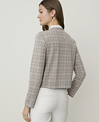 A woman in a plaid jacket and white pants stands against a plain background. carousel Product Image 2