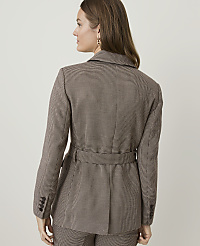 A woman in a brown checkered blazer and matching pants stands against a plain, light-colored background. carousel Product Image 2